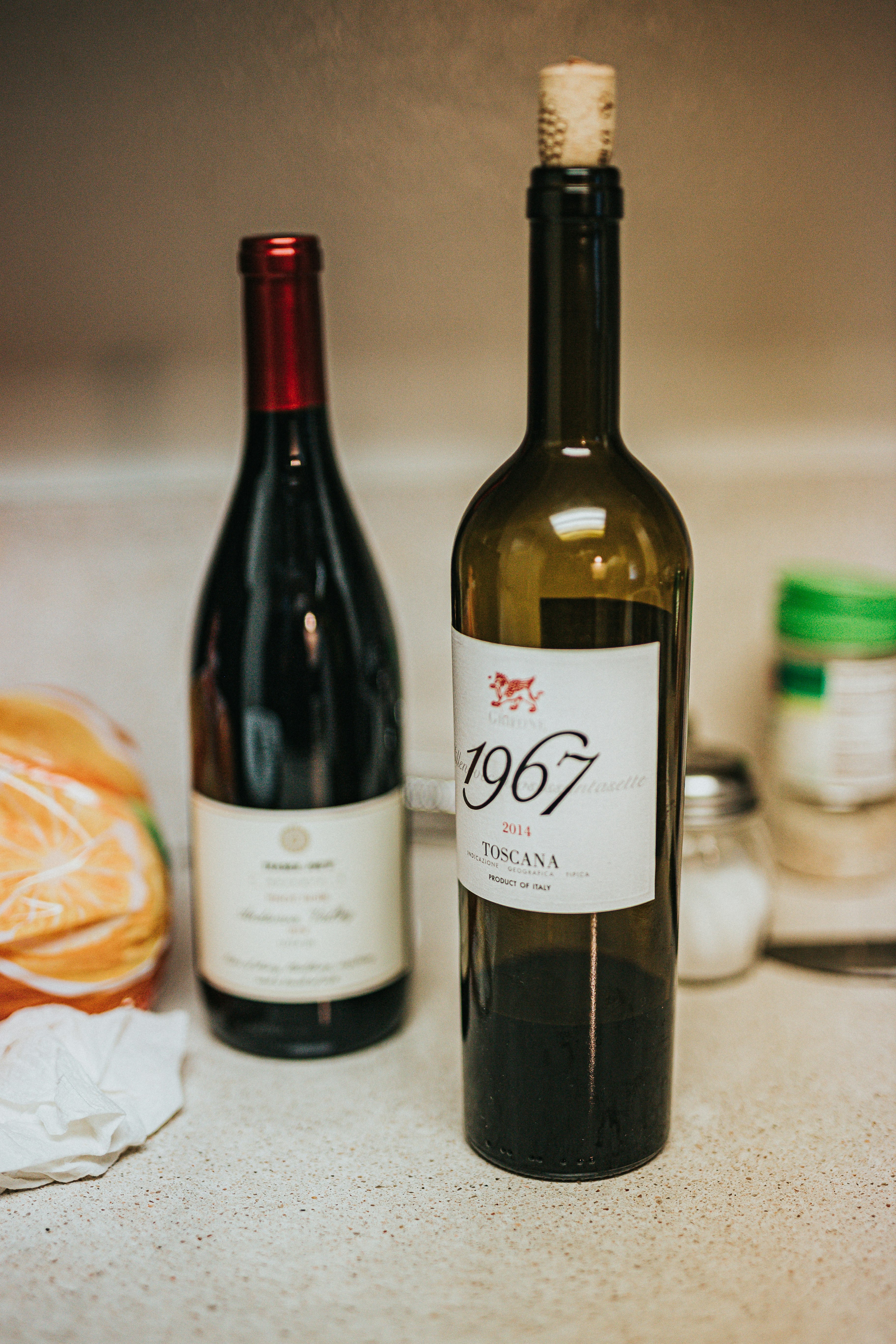 white labeled bottle on white table